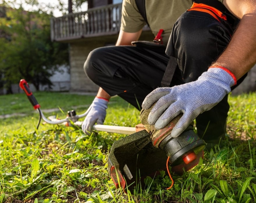a person using a whippersnipper